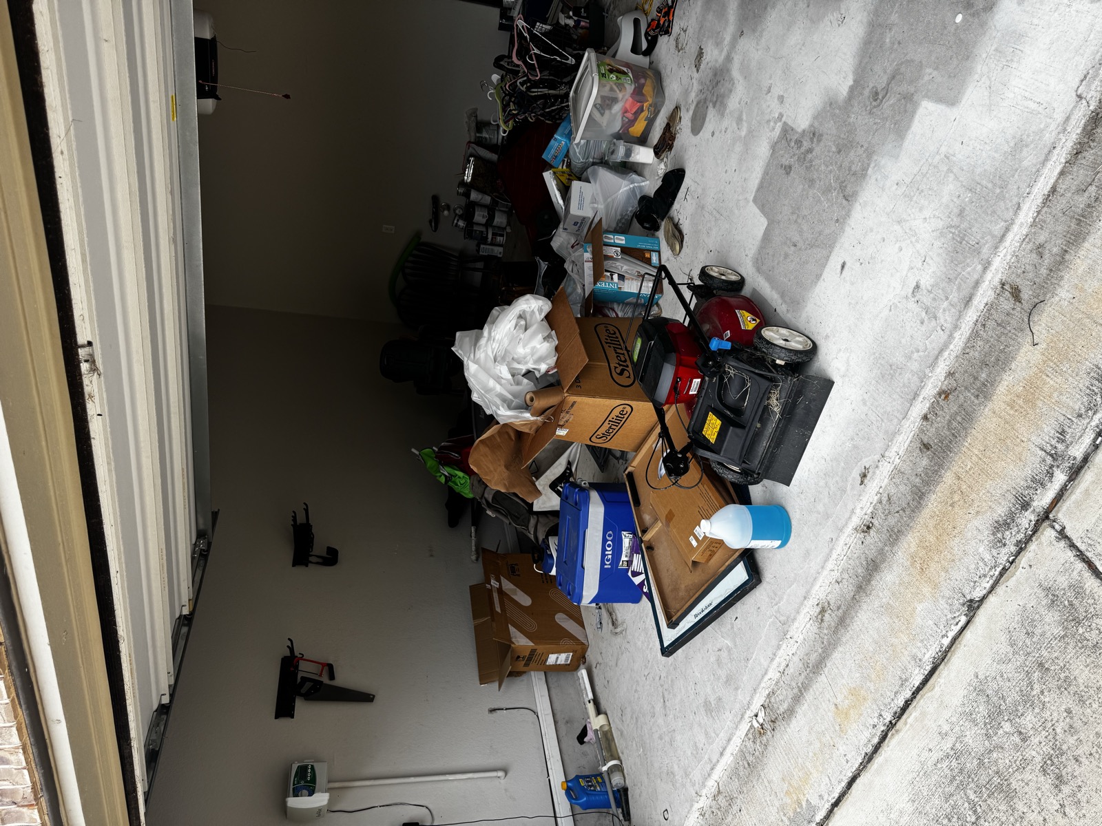 Cluttered garage before junk removal in Leander, TX