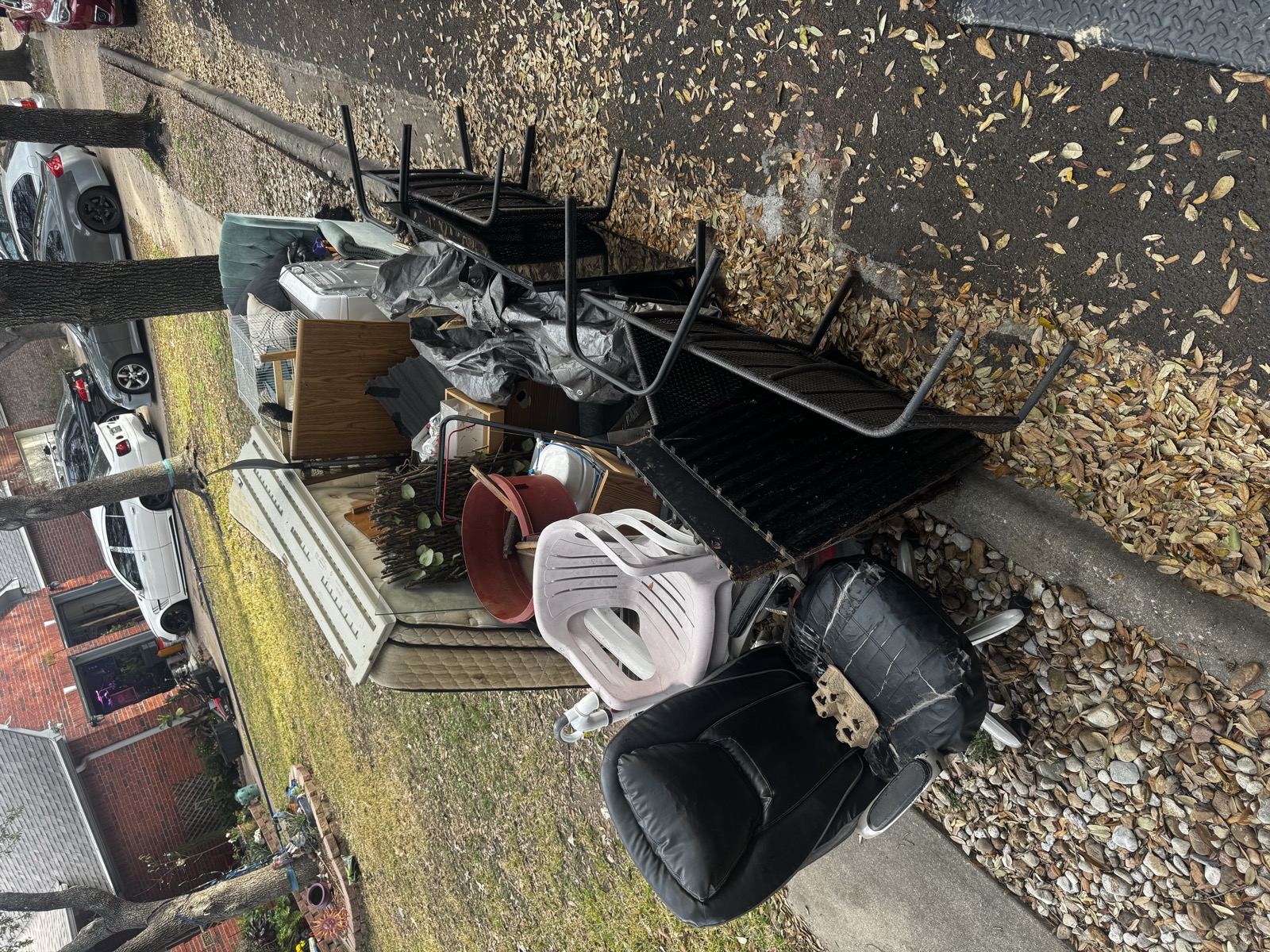 Yard full of old furniture before junk removal